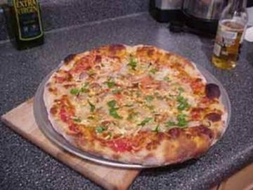 Pizza regina (jambon, champignons, fromage)